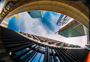 Fisheye perspective capturing modern architecture and skyscrapers in Vienna, Austria.